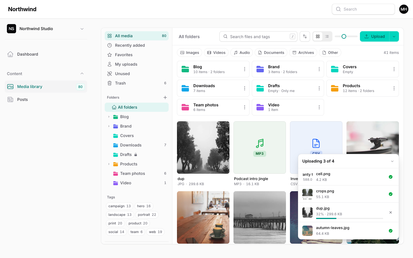 The upload progress tray listing files with progress bars